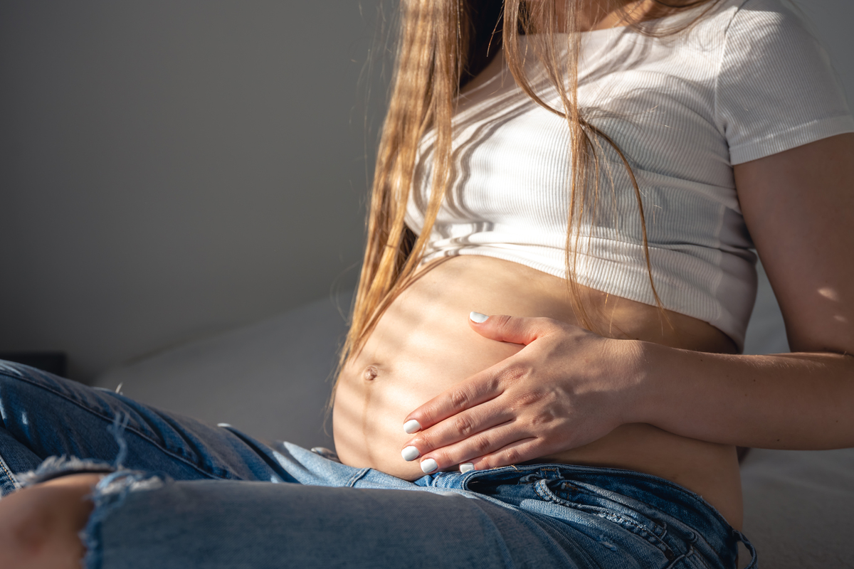 Woman holding pregnant belly